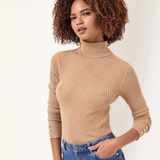 camel roll neck sweater styled with jeans, shown on model