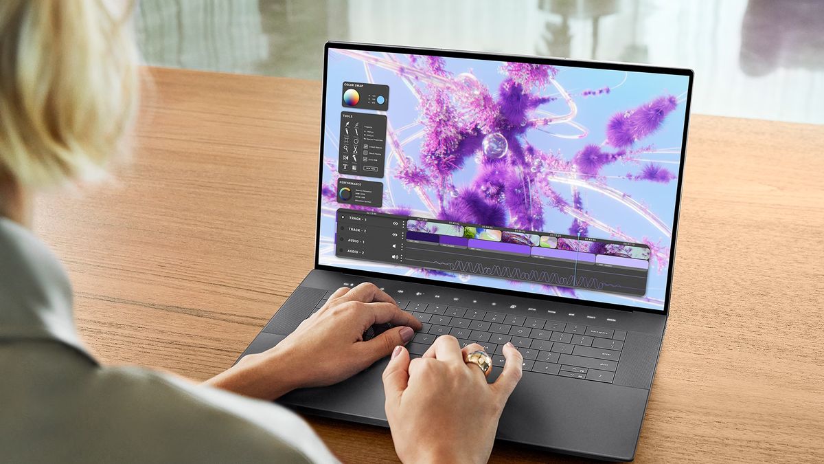 Woman using Dell XPS laptop on a desk