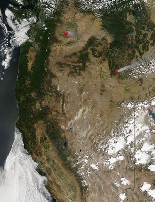 Wildfires (marked in red) in the western United States, seen from space by the Moderate Resolution Imaging Spectroradiometer (MODIS) aboard NASA's Aqua satellite on July 31.