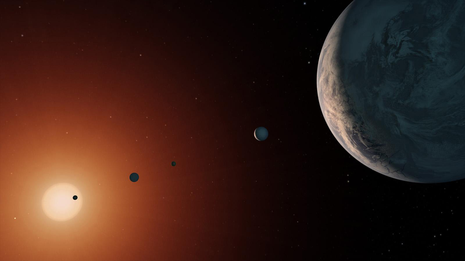 An illustration showing a series of planets in front of a glowing sun in the darkness of space.