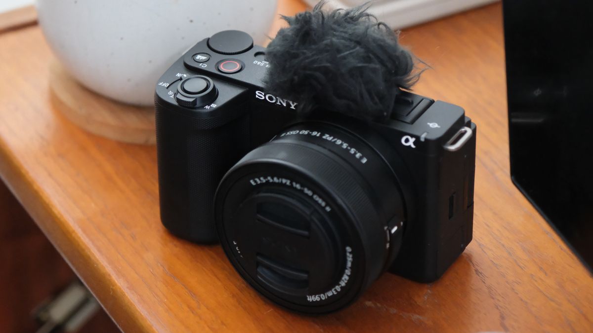 Sony ZV-E10 II digital camera sitting on a polished wooden surface