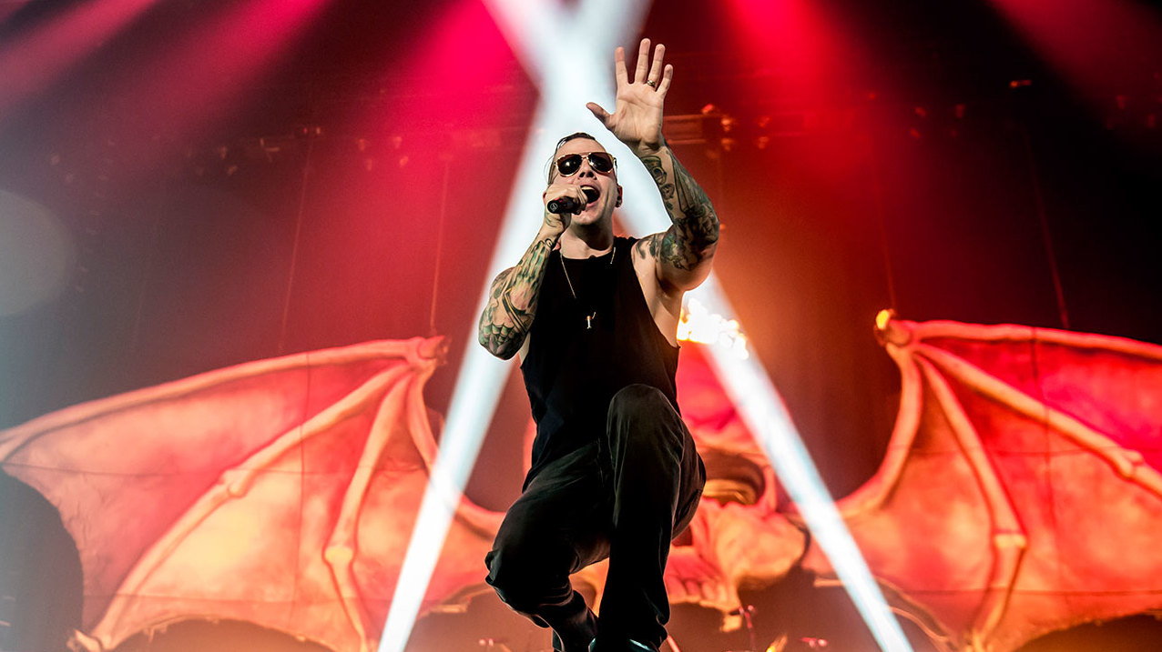 A photograph of M. Shadows of Avenged Sevenfold on stage in London