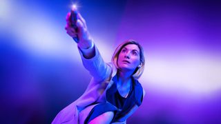 The Thirteenth Doctor (Jodie Whittaker) holds her sonic screwdriver.