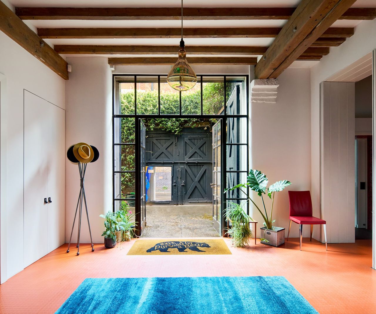 A window framed front door made of steel
