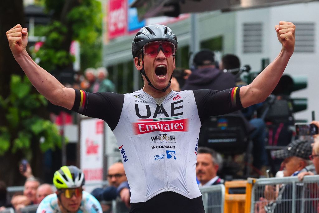 UAE Team Emiratess German rider Pascal Ackermann celebrates after he crossed the finish line to win the eleventh stage of the Giro dItalia 2023 cycling race 219 km between Camaiore and Tortona on May 17 2023 Photo by Luca Bettini AFP Photo by LUCA BETTINIAFP via Getty Images