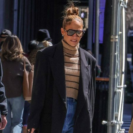 Jennifer Lopez styled baggy jeans and platform heels.