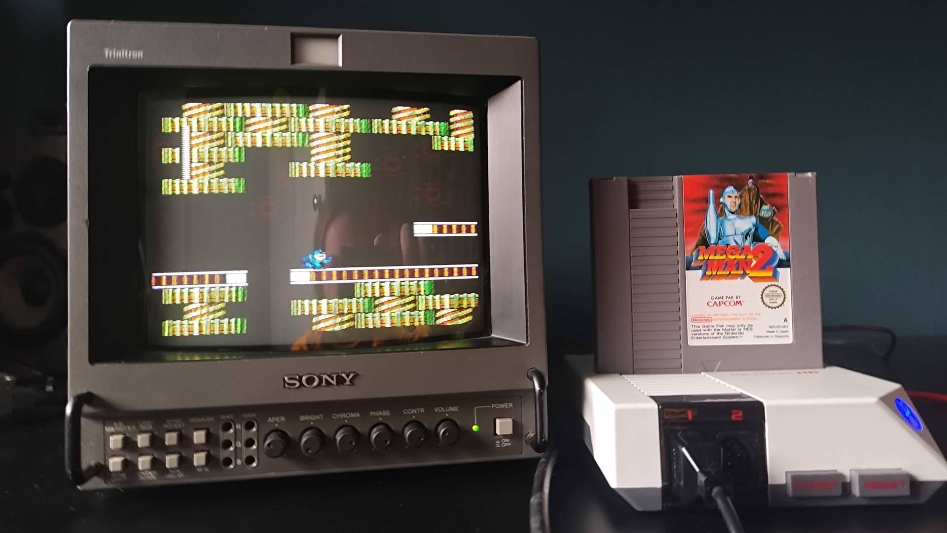 Hyperkin Retron HD connected to Sony PVM CRT with Mega Man 2 gameplay on screen.