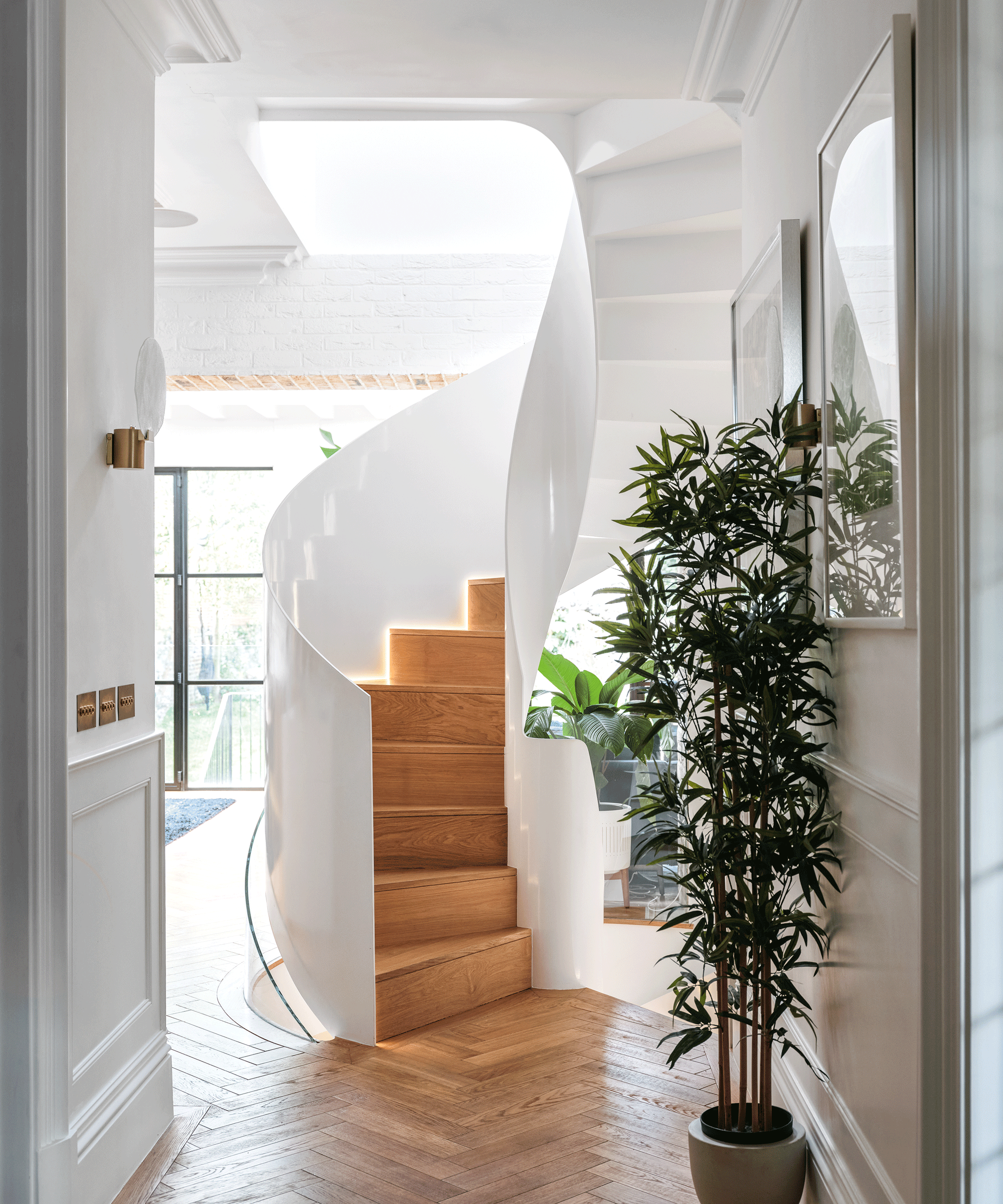 Basement extension showing white staircase and wooden stairs