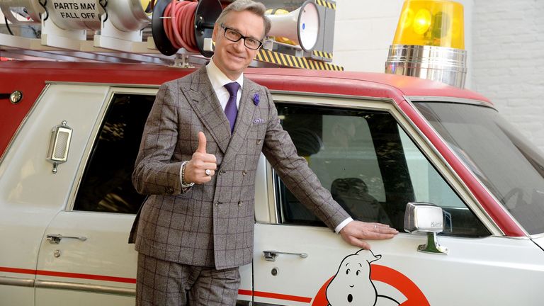Paul Feig thumbs up, with 'Ghostbusters' car