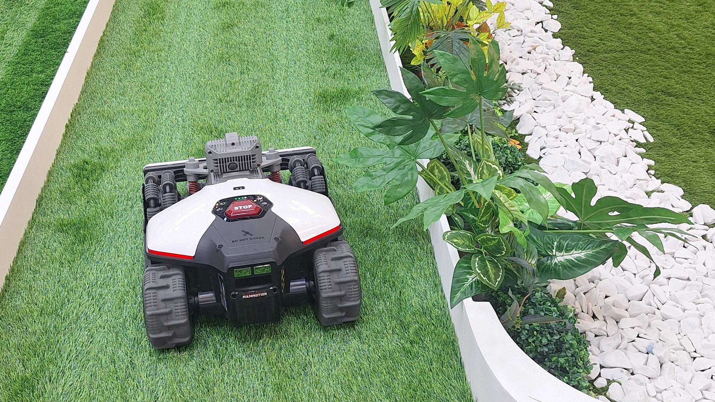 LUBA mini AWD LiDAR robot mower on a demo lawn
