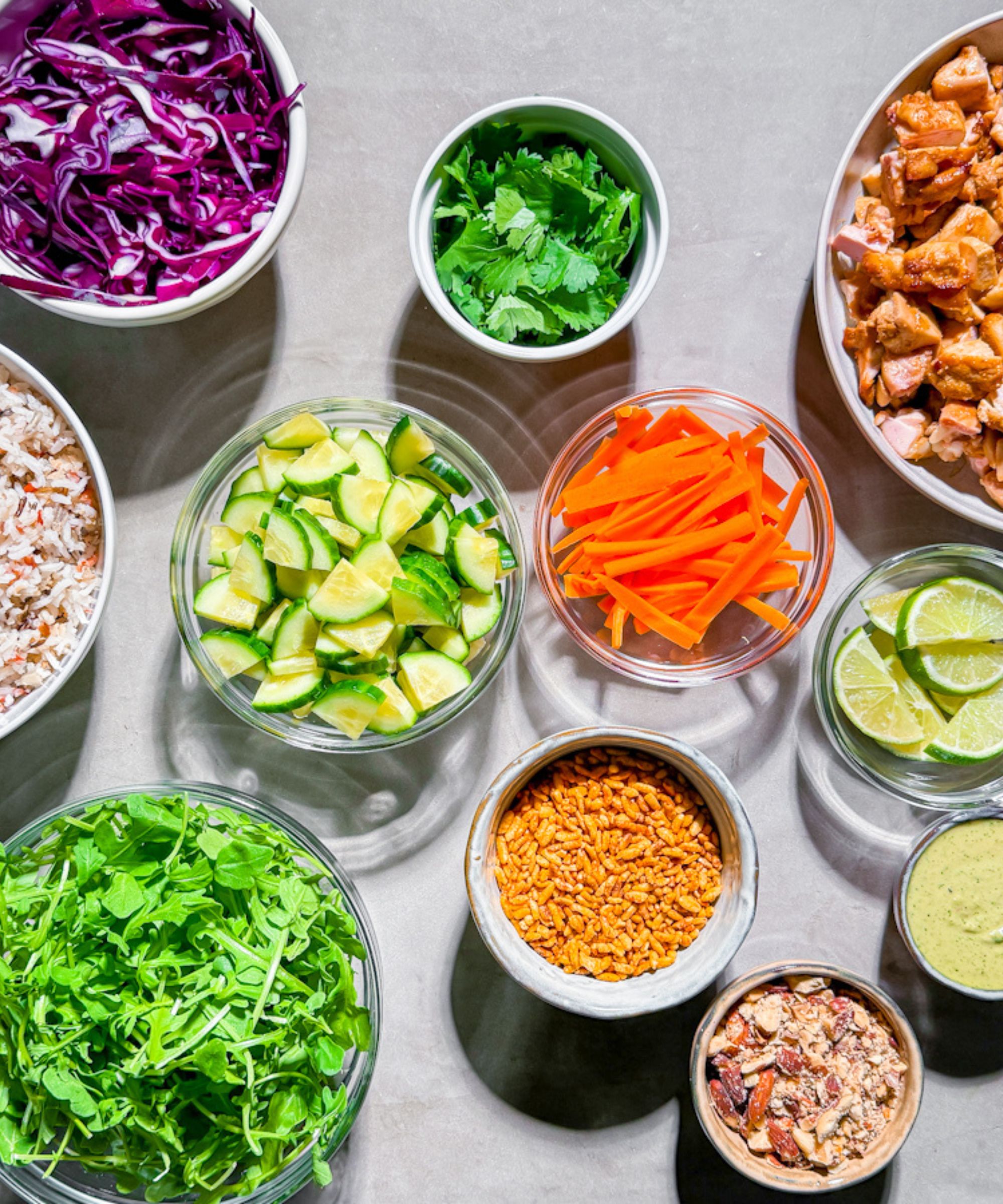 bowls of chopped vegetables and other ingredients