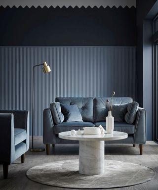 A blue-grey living room paint color idea using Sofology Cricket 2 Seater Sofa, Velvet Slate All Over, £849, Chair, Velvet Slate All Over, £599 and floor lamp, £129