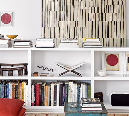 white bookshelf with books and decorative objects