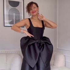 renia jaz wears a black bow top and diamond jewellery