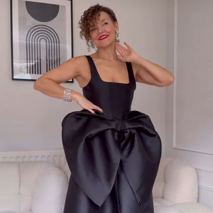 renia jaz wears a black bow top and diamond jewellery