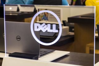 Dell laptop logo displayed in front of Dell laptops