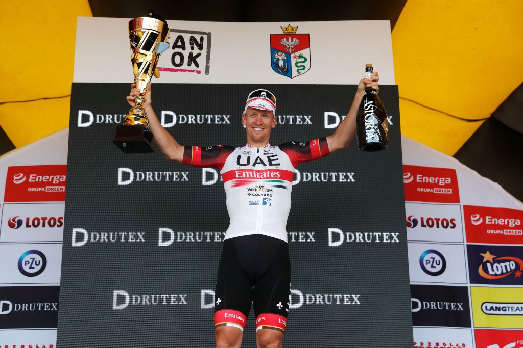 SANOK POLAND AUGUST 02 Pascal Ackermann of Germany and UAE Team Emirates celebrates winning the stage on the podium ceremony after the 79th Tour de Pologne 2022 Stage 4 a 1794km stage from Lesko to Sanok TdP22 WorldTour on August 02 2022 in Sanok Poland Photo by Bas CzerwinskiGetty Images