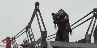 Warwick Davis as Weazel firing a rocket launcher in Solo: A Star Wars Story