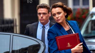 Richard Madden as David Budd getting out of a car during the Netflix show, Bodyguard.