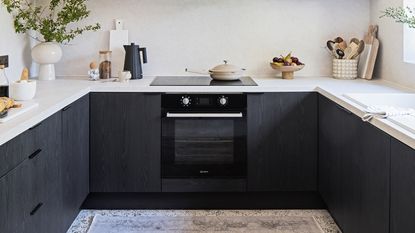 Navy and oak two tone kitchen with terrazzo worktop