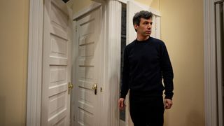 Nathan Fielder in front of a door in The Rehearsal