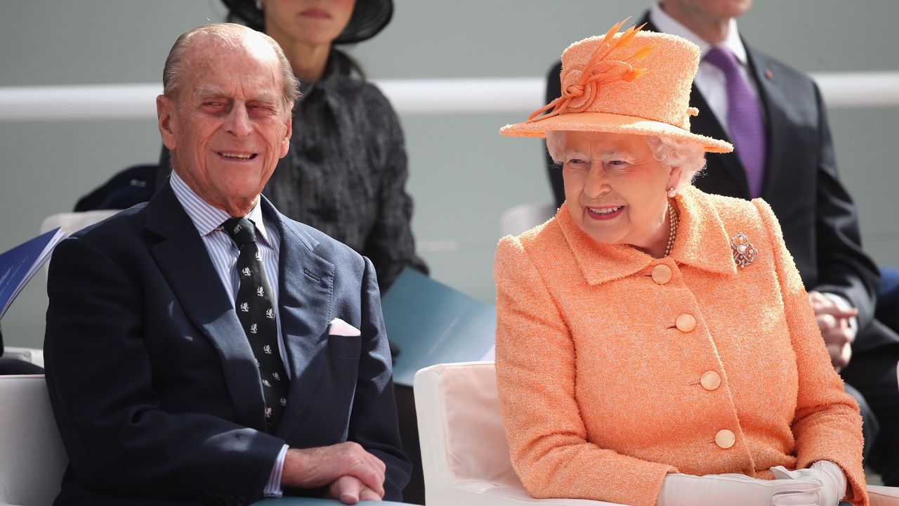 Prince Philip and Queen Elizabeth II chat as she takes part in the naming ceremony for the P&amp;O Cruises vessel at Ocean Cruise Terminal on March 10, 2015 in Southampton, England