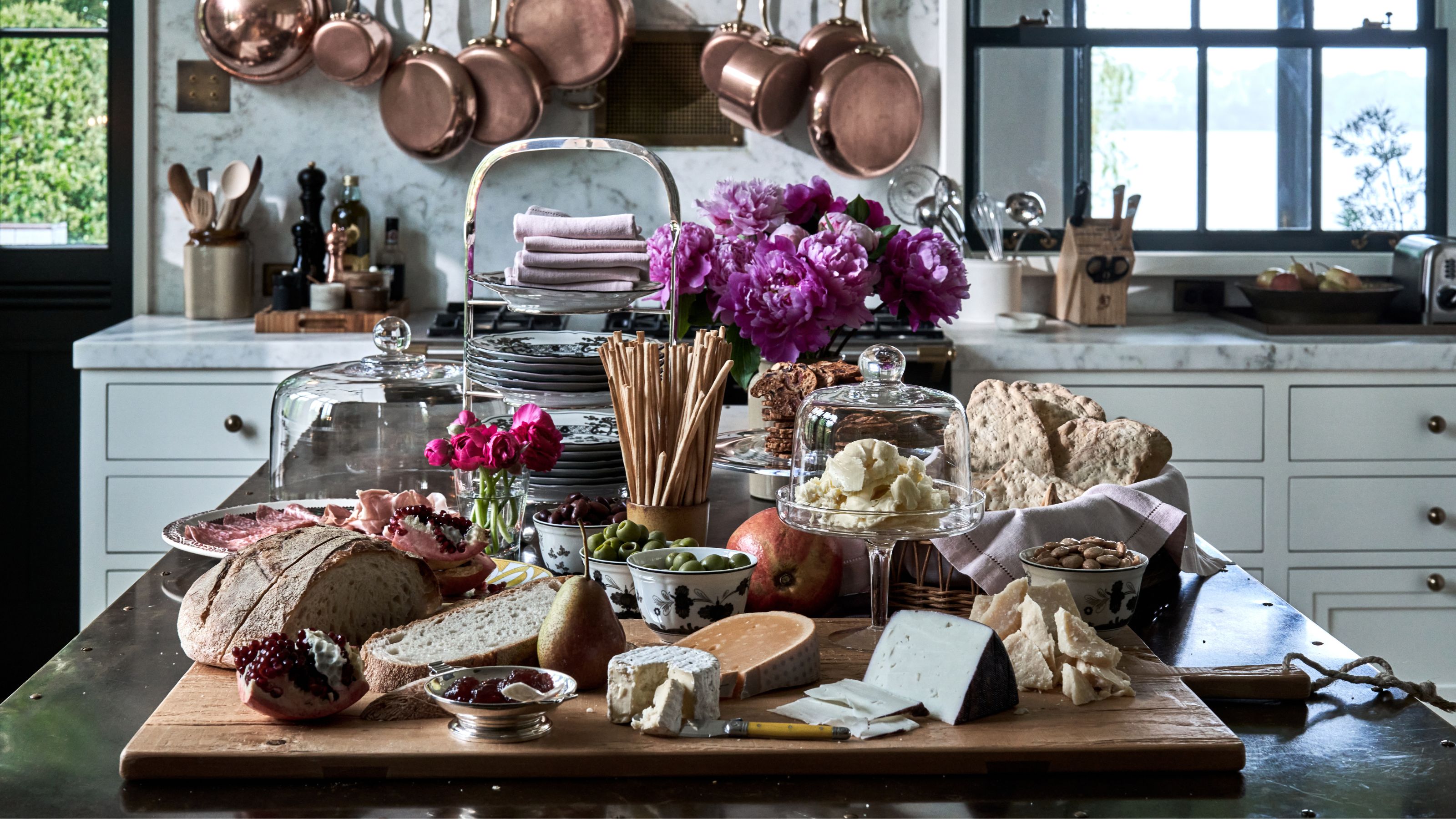 Loaded up kitchen island with charcuterie in a traditional kitchen