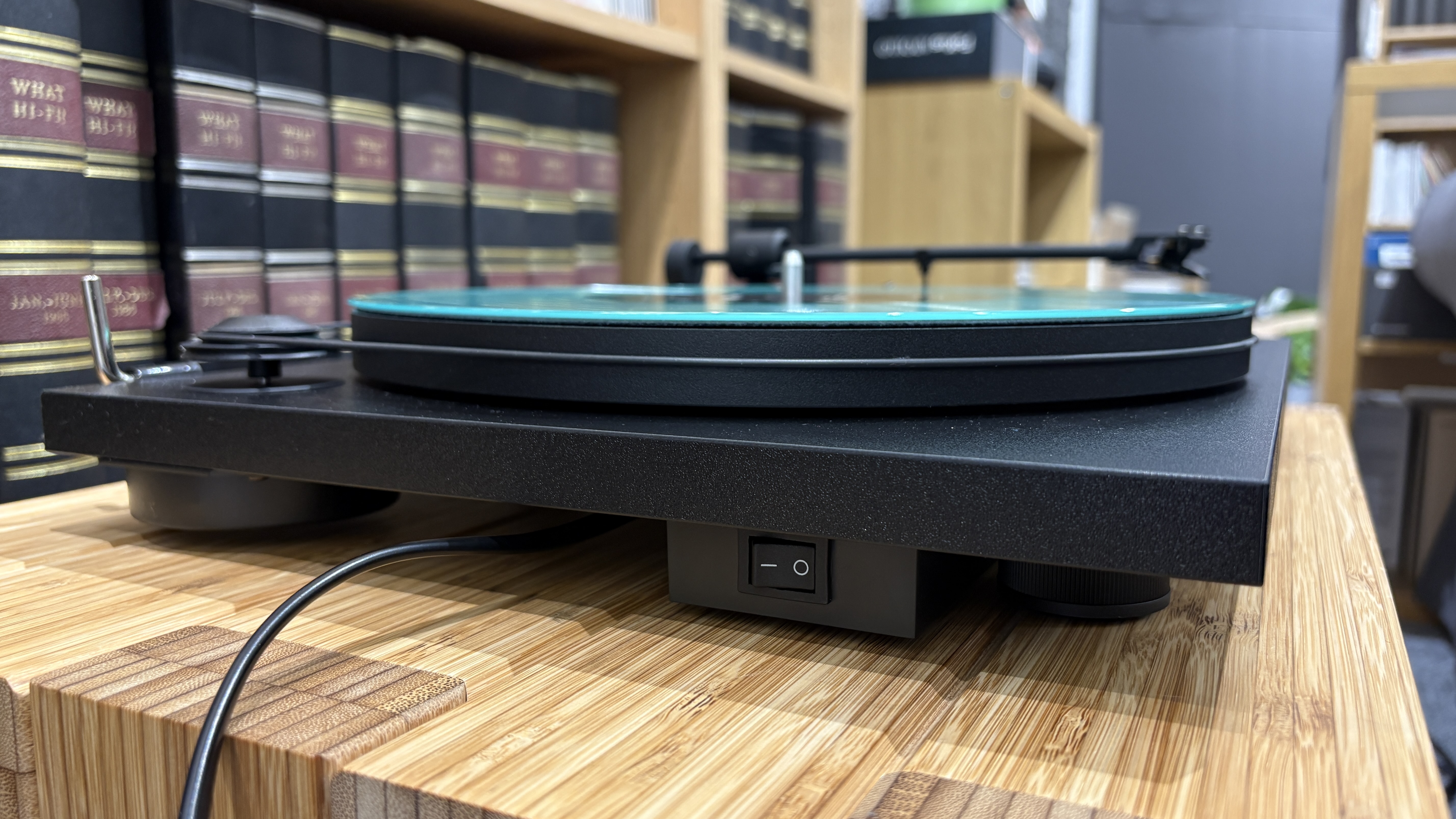Pro-Ject Primary E turntable on wooden rack