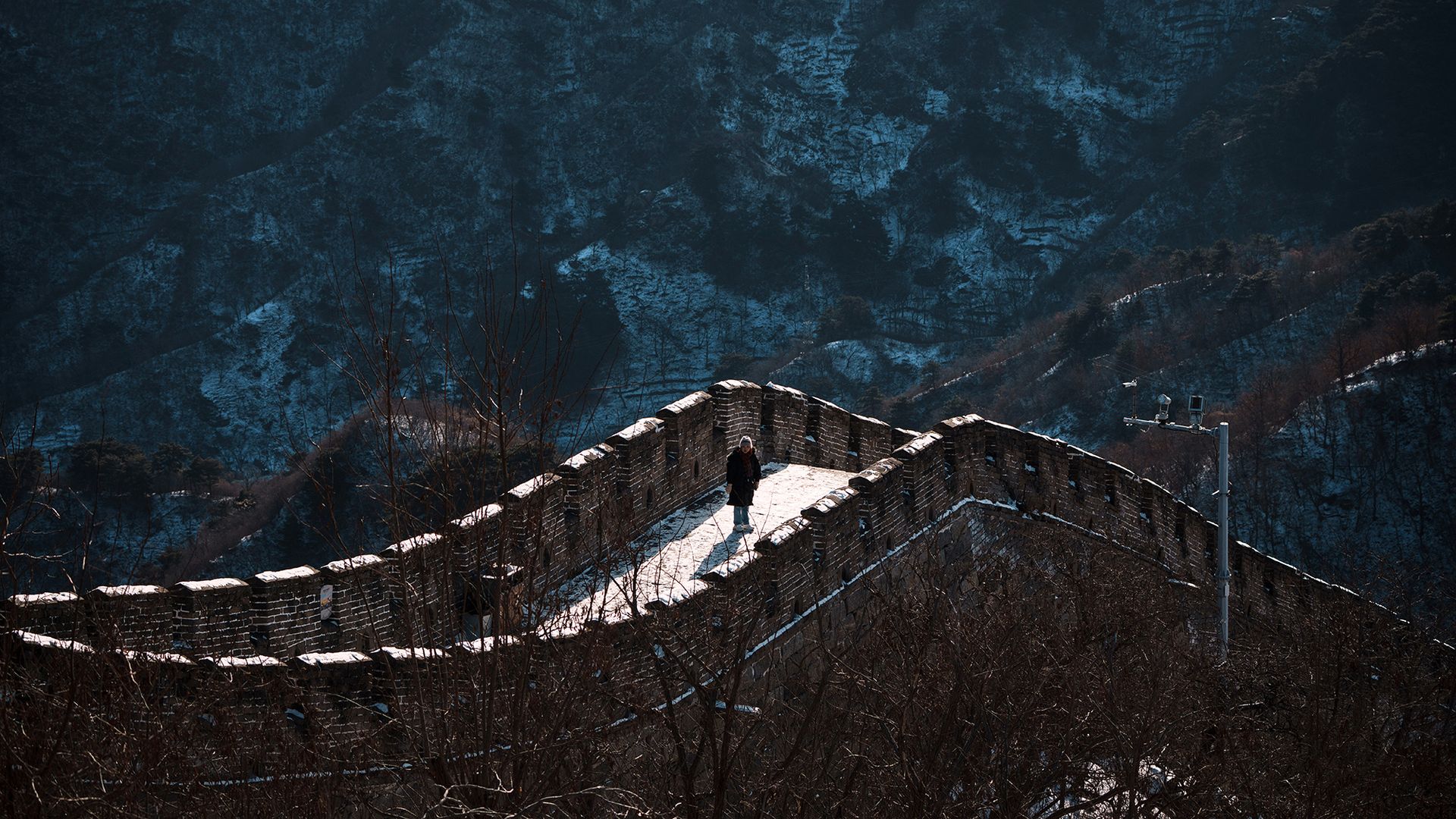 
                                A tourist walks along the Juyongguan section of the Great Wall on the outskirts of Beijing, China
                            