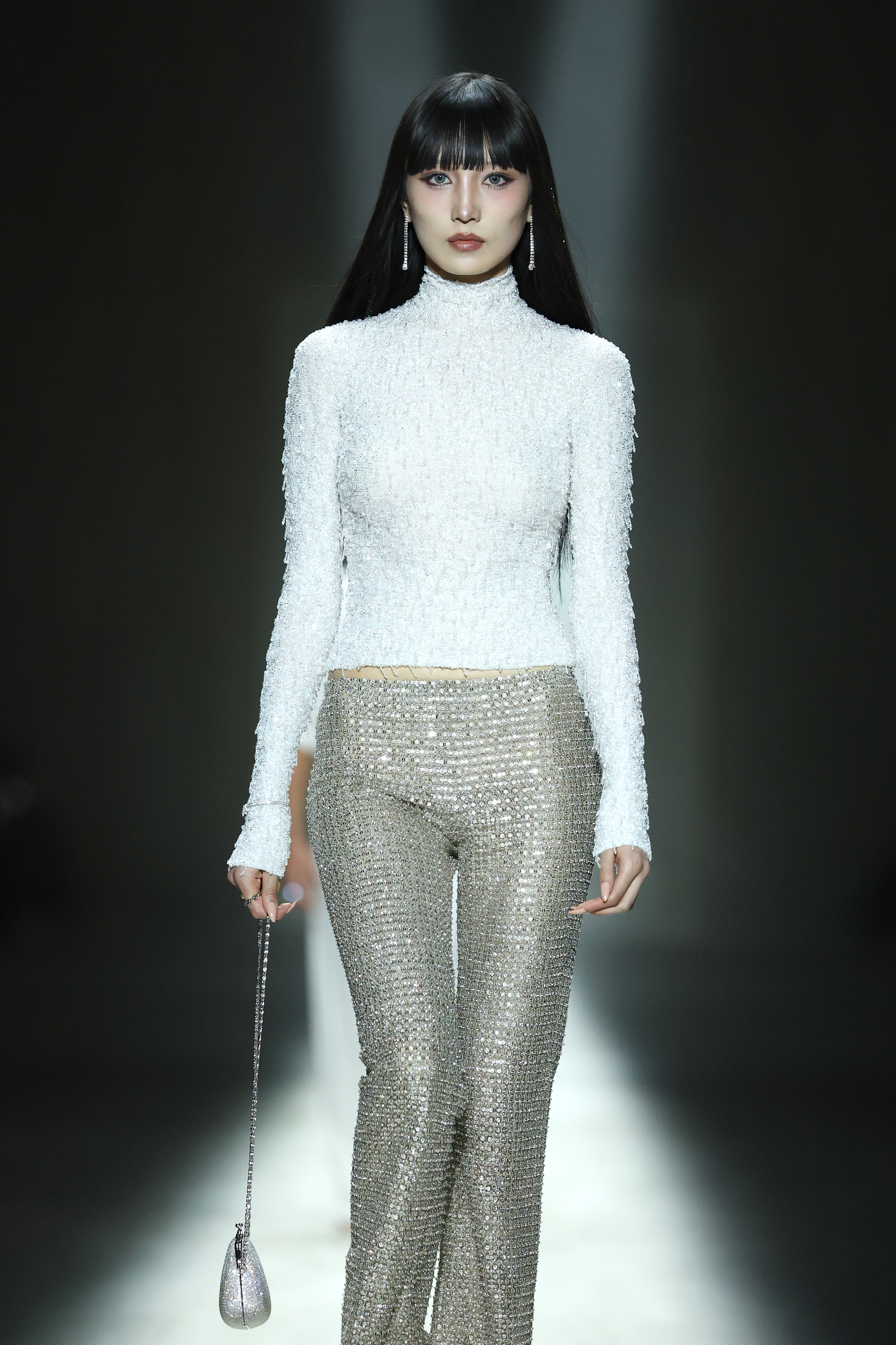 a model on the Gucci fall 2026 runway wearing sparkly pants