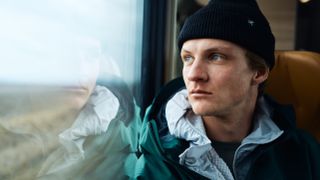 Max Kroneck on a train in the Arc'teryx film Going East