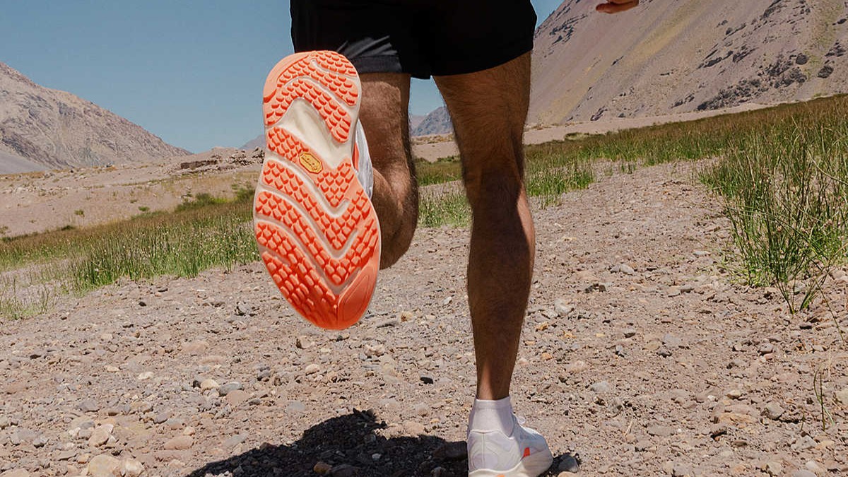 A trail runner wearing the Merrell ProMorph