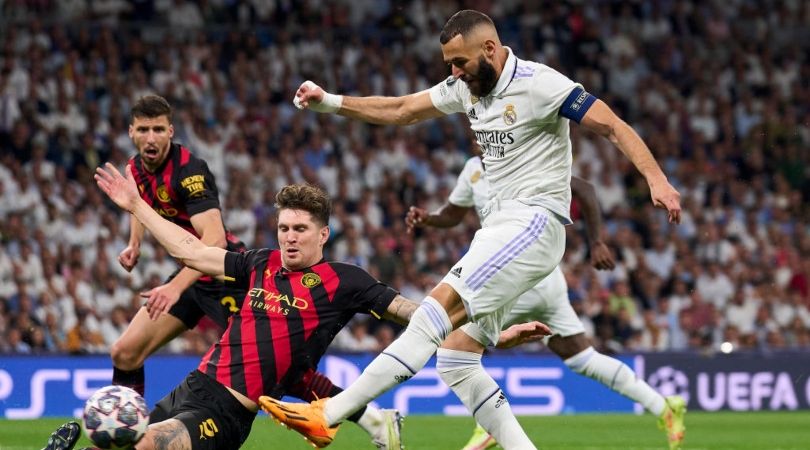 Karim Benzema and John Stones battle in the REal Madrid vs Manchester City Champions League semi-final first leg