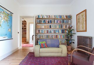 living room with sofa and bookshelf