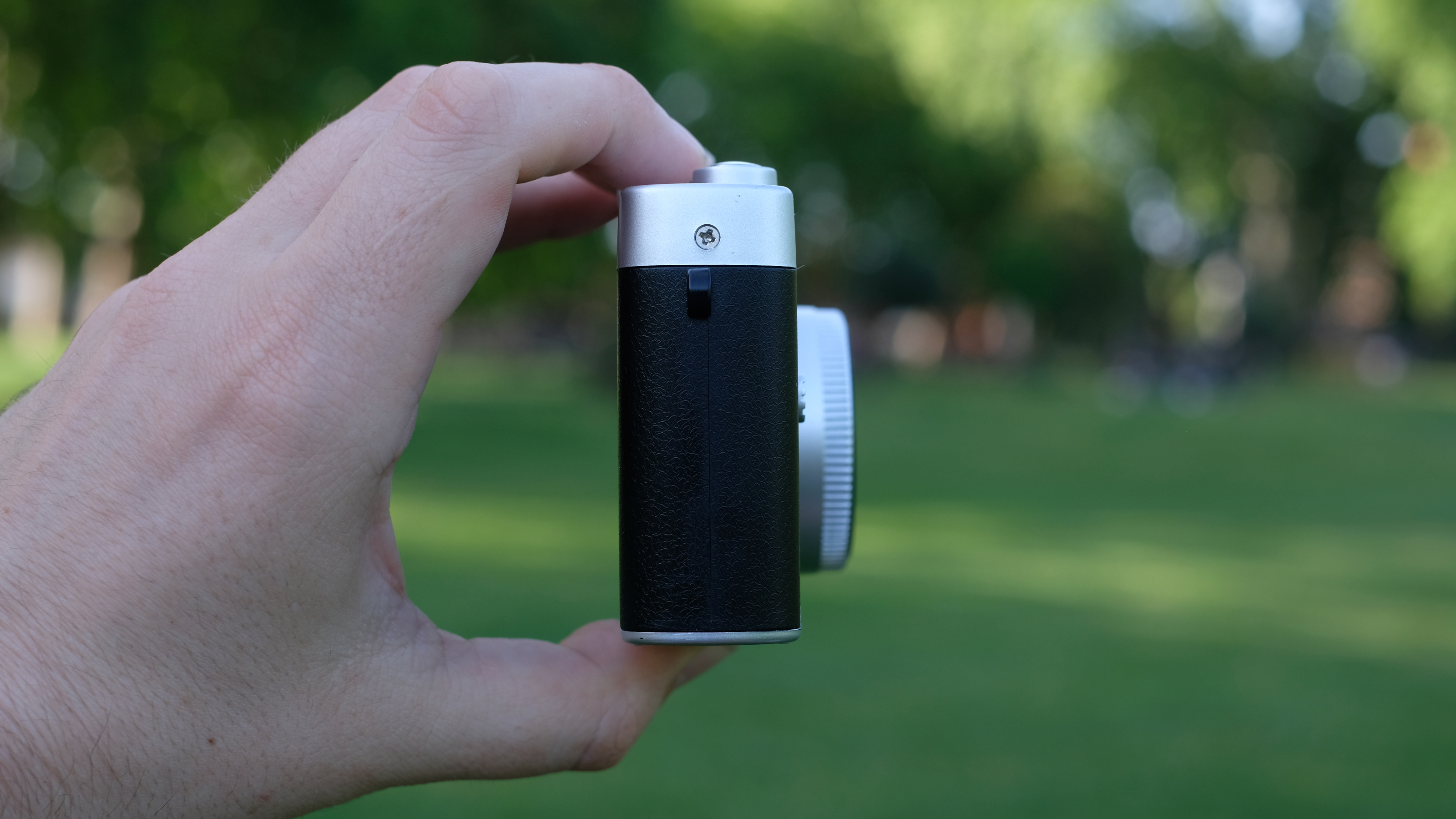 Photograph of Camp Snap CS-Pro digital compact camera held in side profile facing right