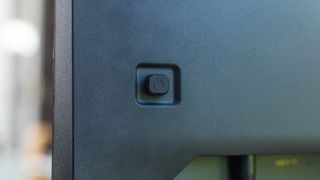 A closeup of OSD joystick on the Porsche Design AOC Agon PD27