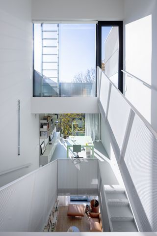 Interior looking through staircase and internal void at Narrow House