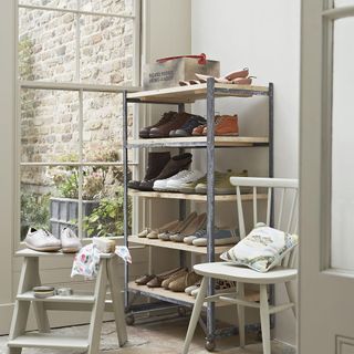 shoe rack with white chairs