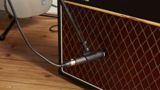 An SM57 microphone on a Vox guitar amplifier