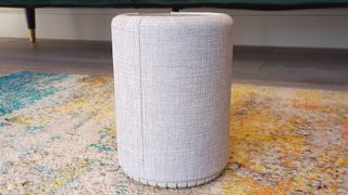 Audio Pro G10: Image shows the gray speaker resting on a colorful rug.