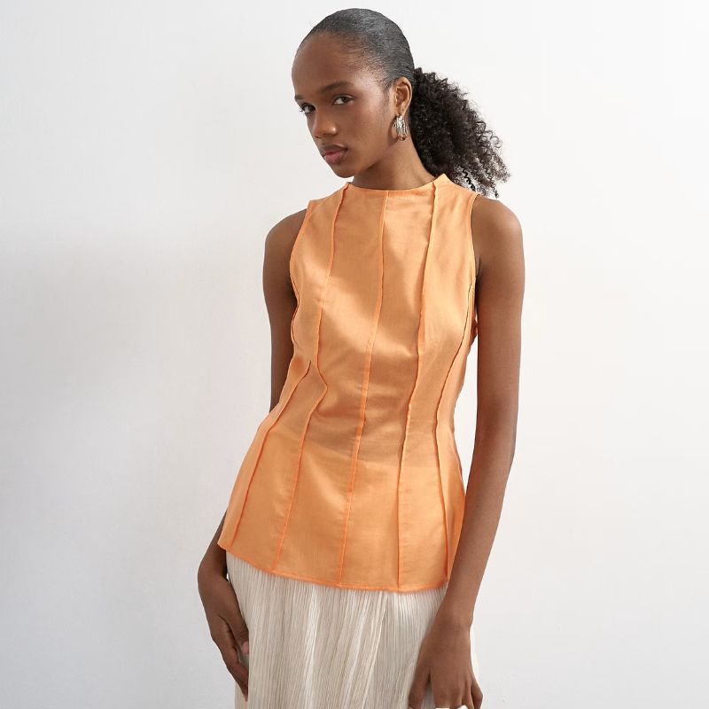 Seamed detail high neck top in orange on model