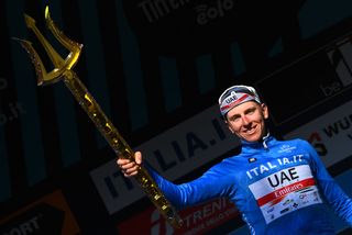 SAN BENEDETTO DEL TRONTO ITALY MARCH 13 Tadej Pogacar of Slovenia and UAE Team Emirates Blue Leader Jersey celebrates at podium with the Trident race trophy during the 57th TirrenoAdriatico 2022 Stage 7 a 159km stage from San Benedetto del Tronto to San Benedetto del Tronto TirrenoAdriatico WorldTour on March 13 2022 in San Benedetto del Tronto Italy Photo by Tim de WaeleGetty Images
