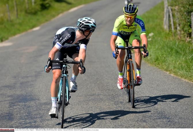 Jan Bakelants (Omega Pharma-Quick Step) checks on Tinko-Saxo's Nico Roche