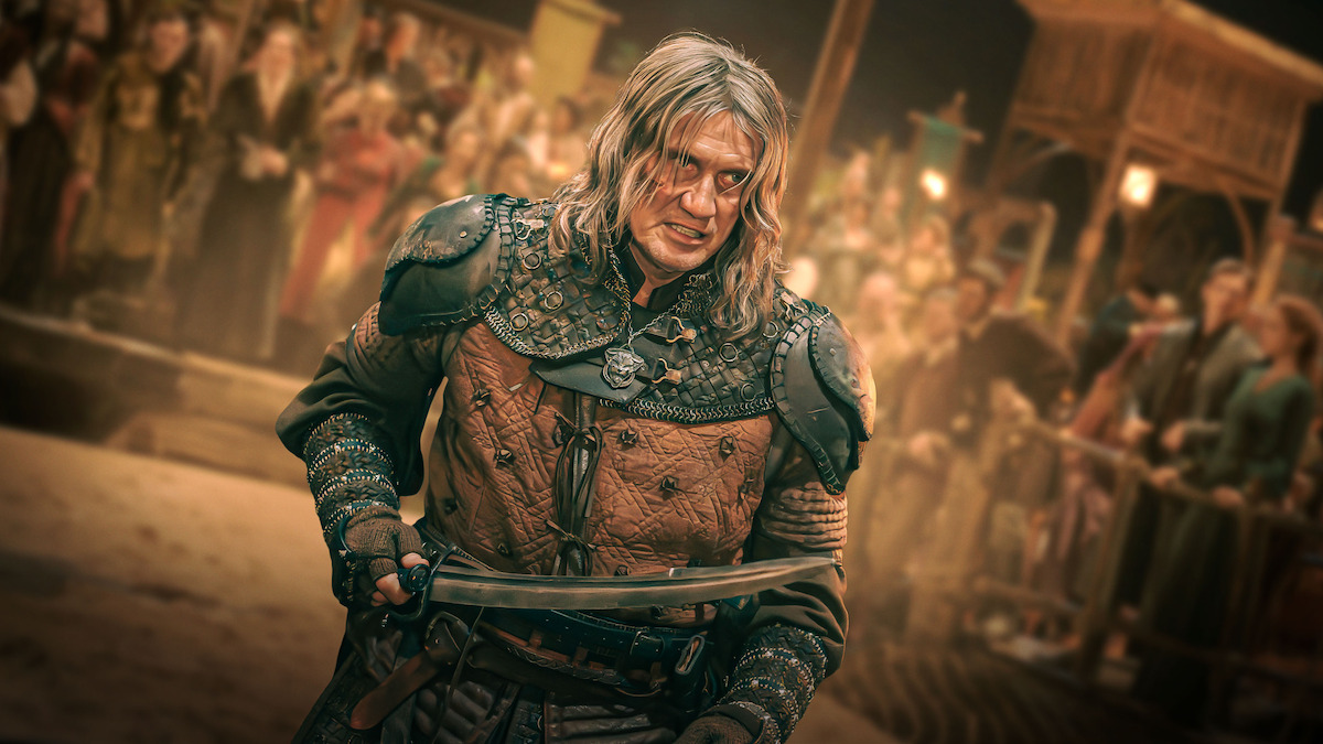 Dolph Lundgren as a Witcher holding a sword