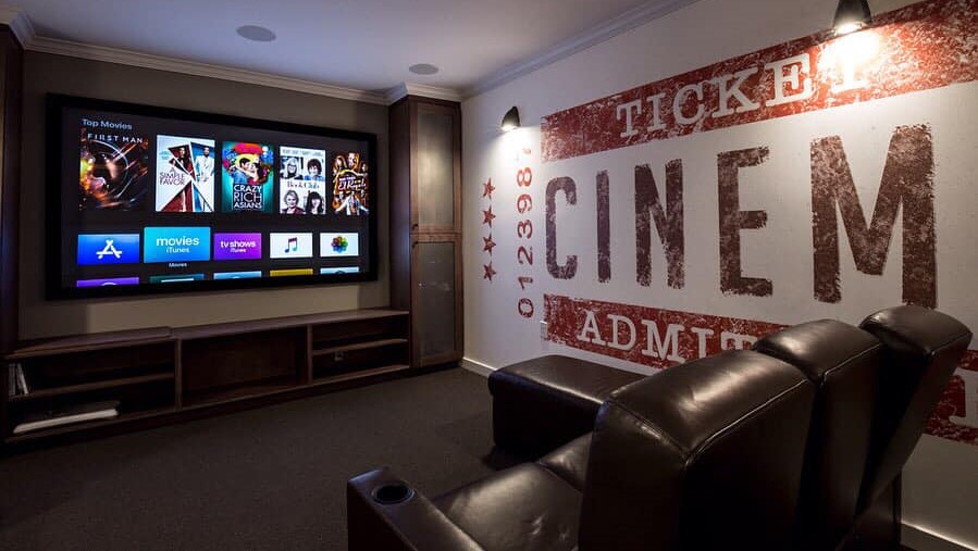 Home theater system showing projection screen and home theater seating