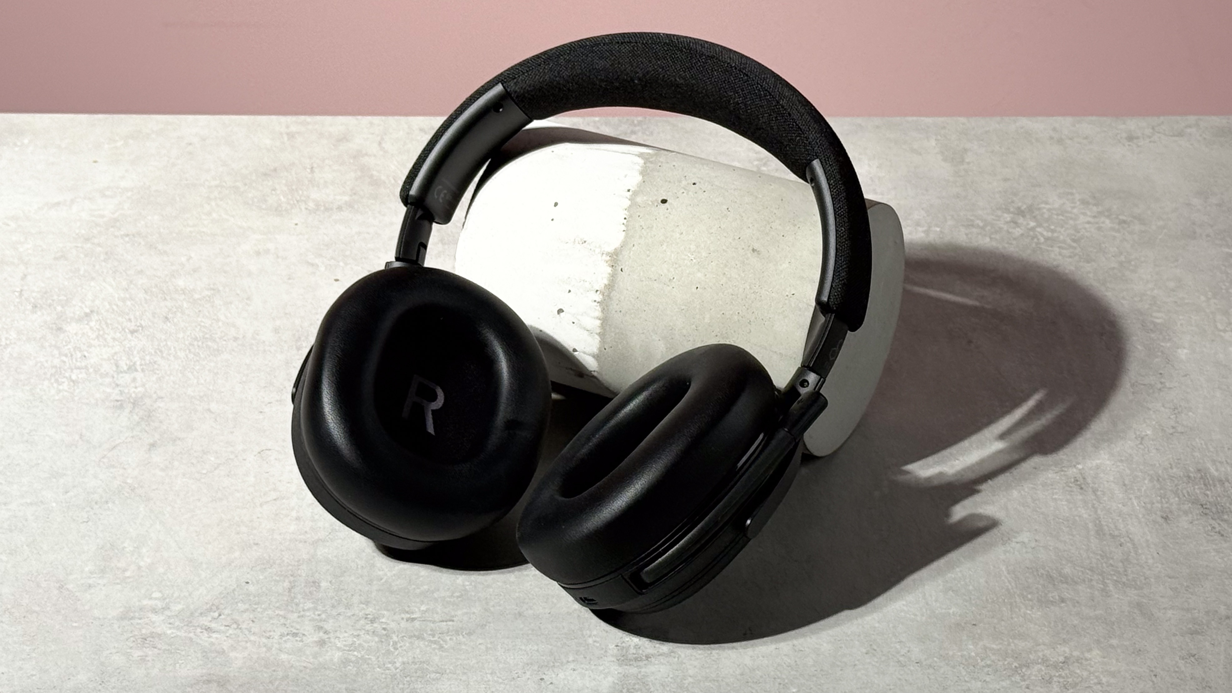 The Final VR3000 EX for Gaming open and leant against a stone and concrete cylinder on its side.