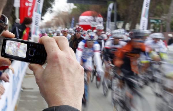 A spectator captures the peloton