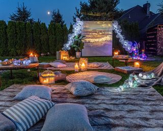 outdoor cinema setup with rugs and cushions from dekoria