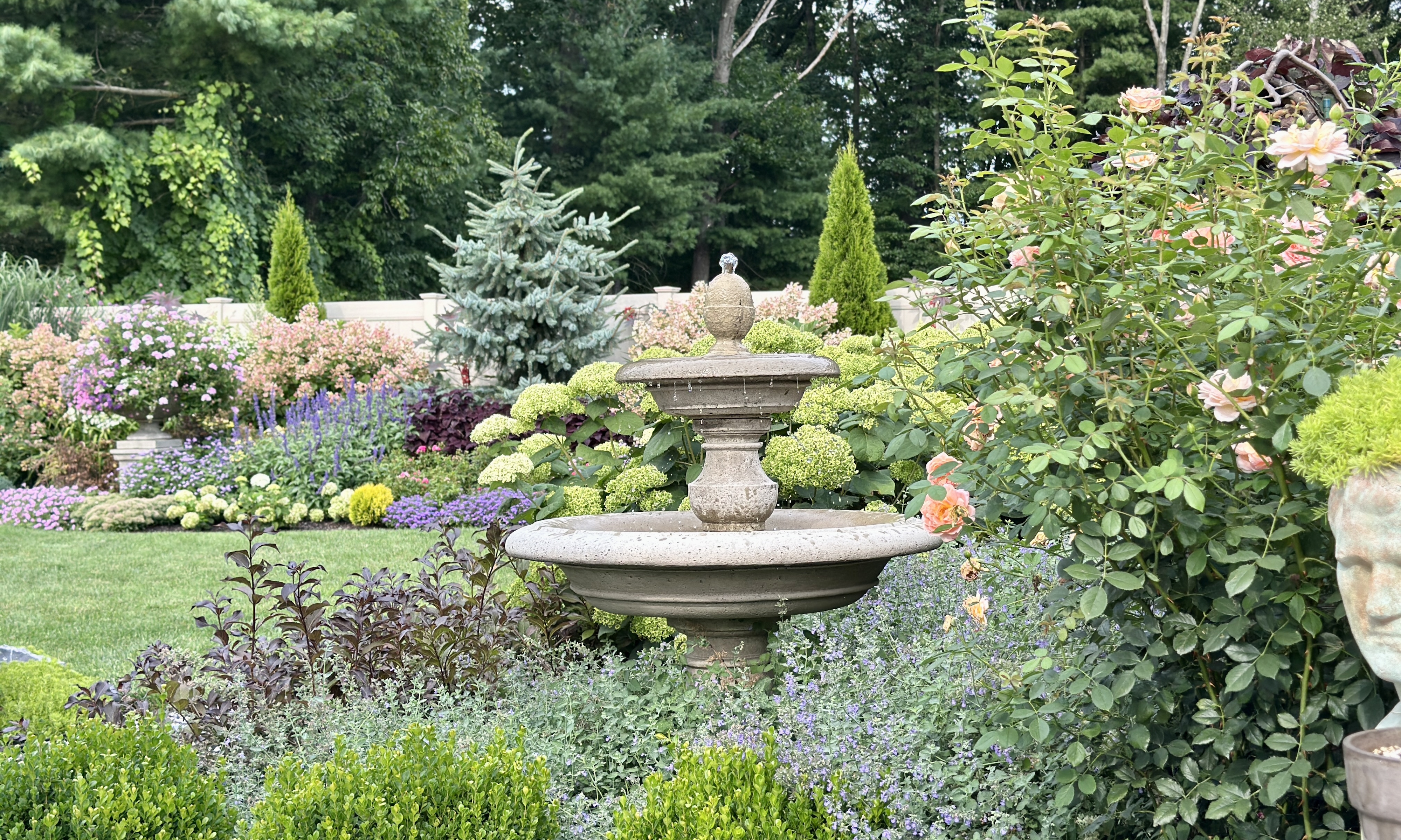 Grow For Me Gardening fountain in flower border