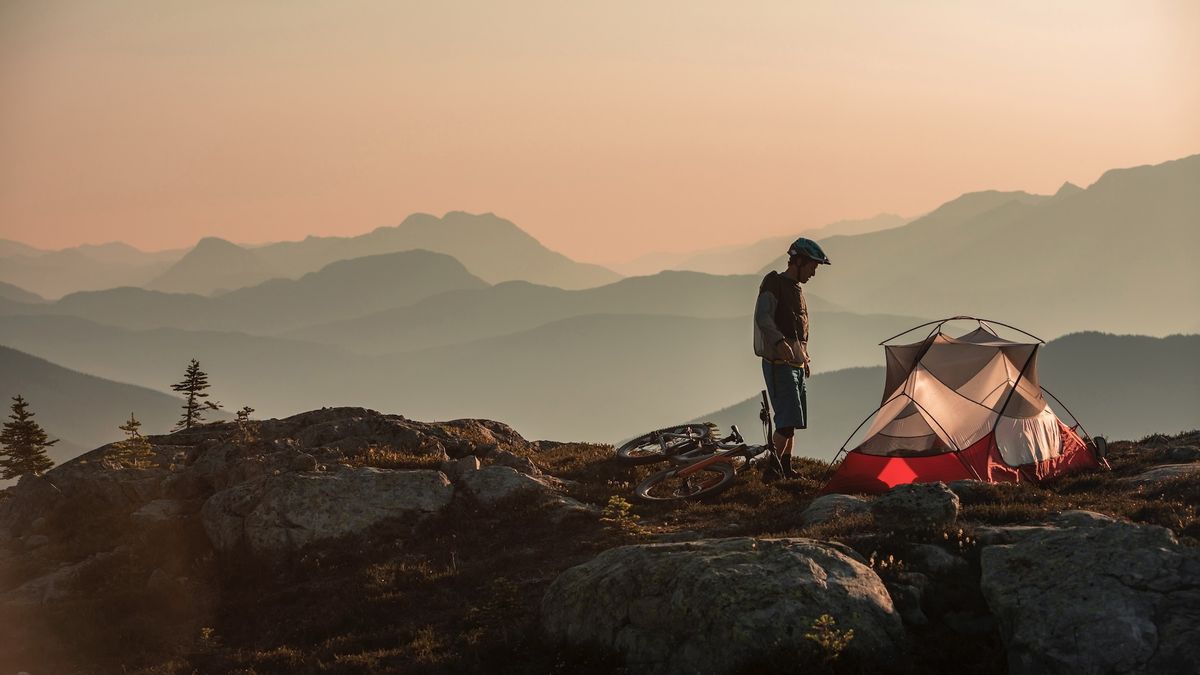 bikepacker and tent